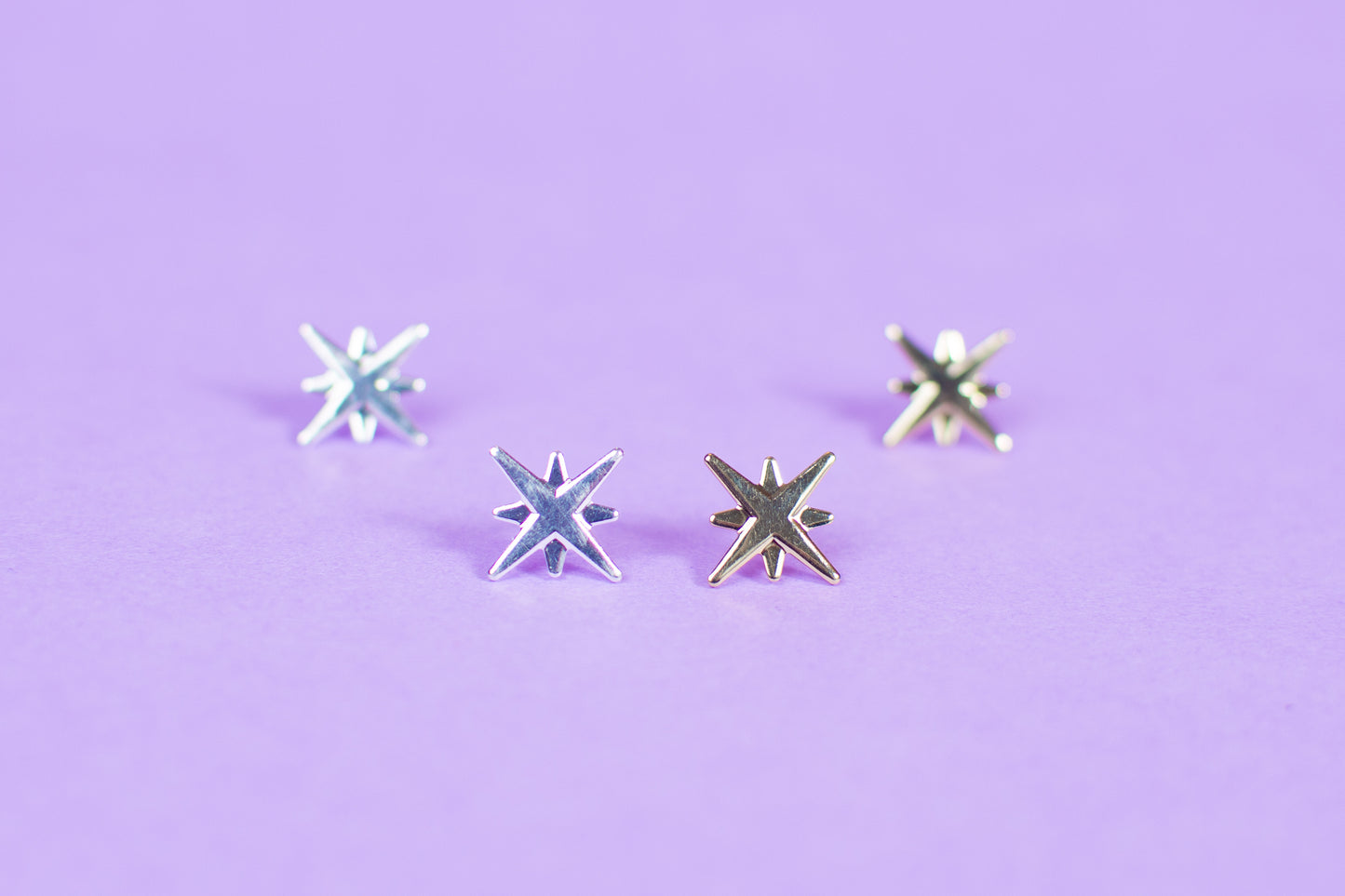 Aros estrella 4 puntas silver