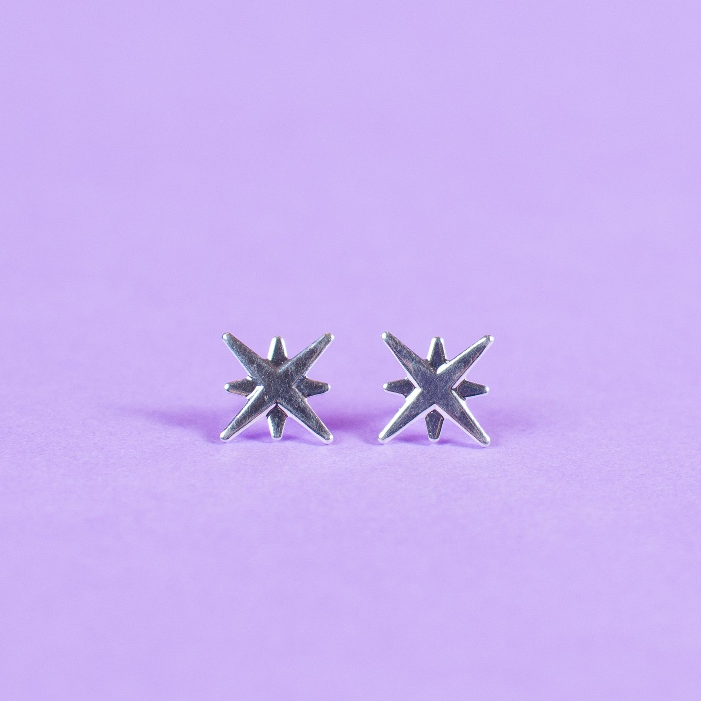 Aros estrella 4 puntas silver